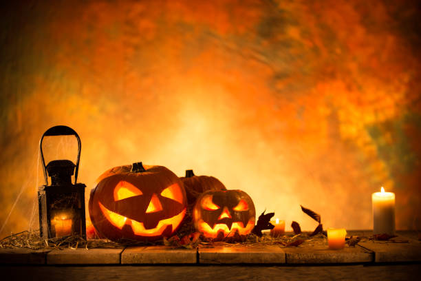 istock Halloween Pumpkins on old wooden table 854643446