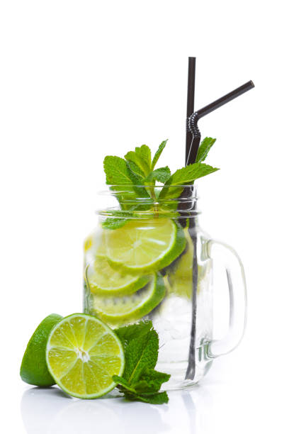 istock Cocktail with mint, lime and tonic. On a white background. Top view. 854643720