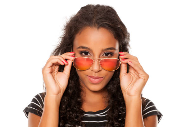 istock beautiful young dark skinned woman posing with sunglasses 854646470