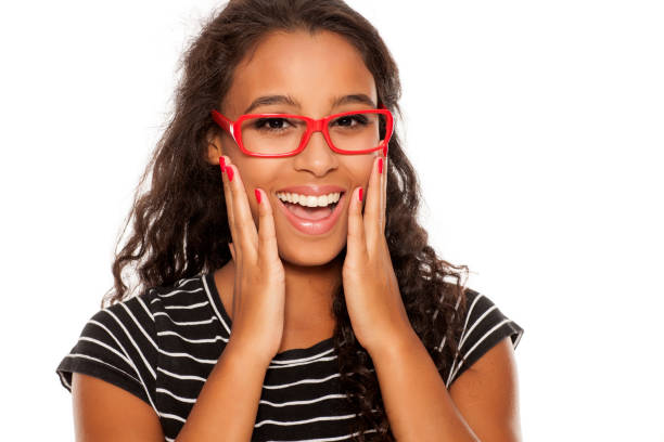istock beautiful young dark skinned woman posing with red eyeglasses 854646602