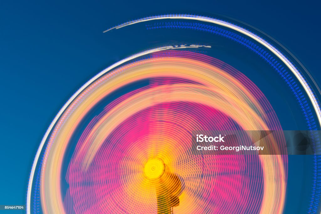 Fairground at night. Blured motion. Motion Stock Photo