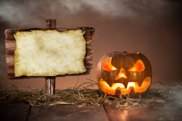 istock Halloween Pumpkin on old wooden table 854652750