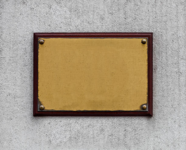istock Bronze steel plate on stone concrete wall 854654060