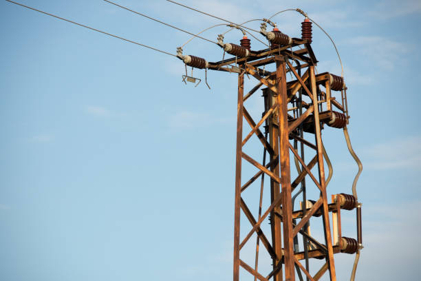 istock Metal pillar High Voltage against the blue sky. 854656286