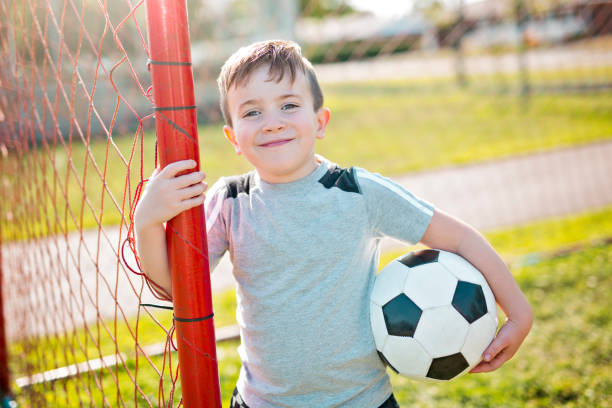 istock Young caucassian soccer player football 854657020