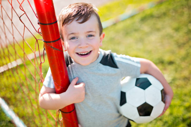 istock Young caucassian soccer player football 854657274