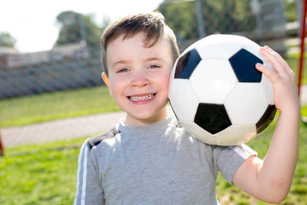 istock Young caucassian soccer player football 854657398