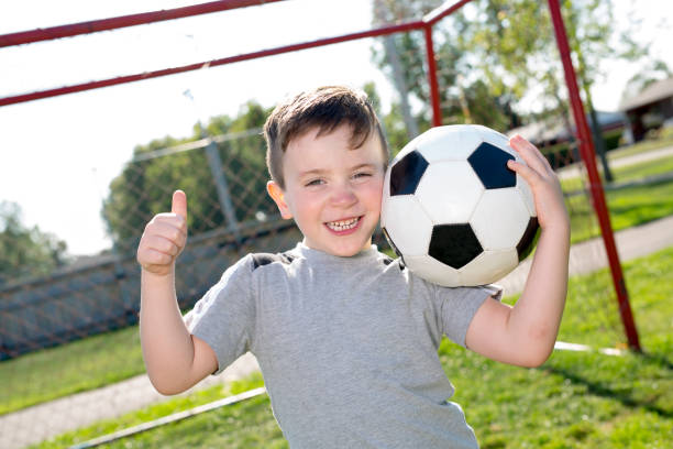 istock Young caucassian soccer player football 854657556