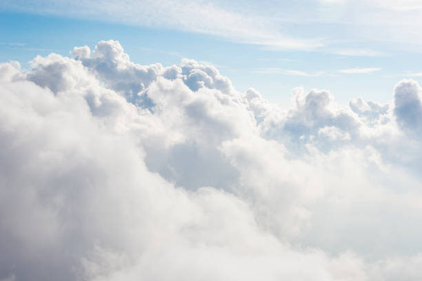 Flying over the clouds stock photo