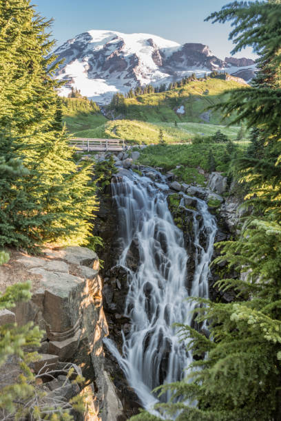 istock Myrtle Falls Spills Over Lush Valley 854658424