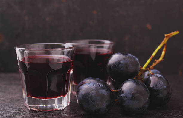 istock ripe grapes, red wine and a glass 854662910