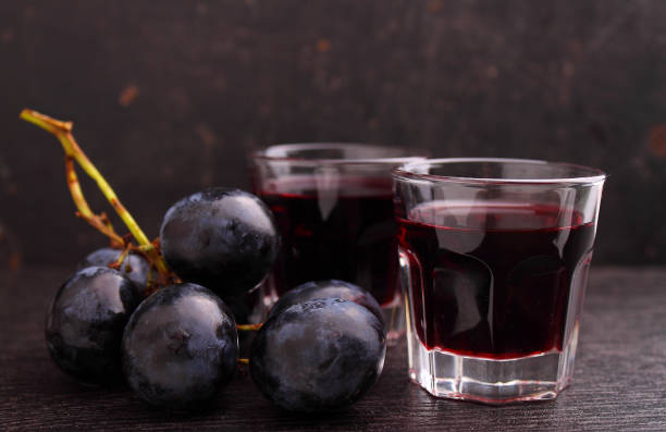 istock ripe grapes, red wine and a glass 854662916