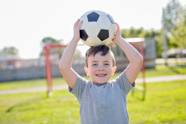 Young caucassian soccer player football