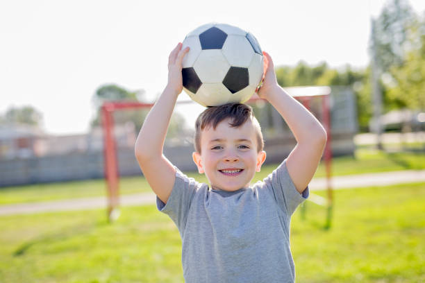 Young caucassian soccer player football A Young caucassian soccer player football outside 2000 photos stock pictures, royalty-free photos & images