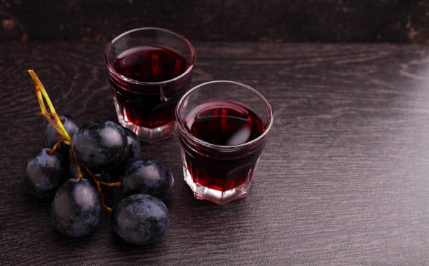 istock ripe grapes, red wine and a glass 854662944
