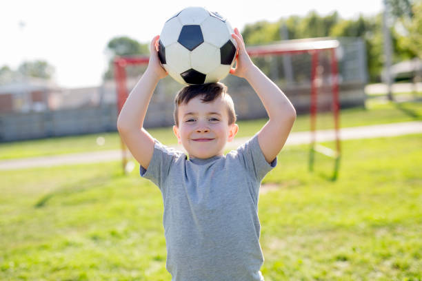 istock Young caucassian soccer player football 854663048