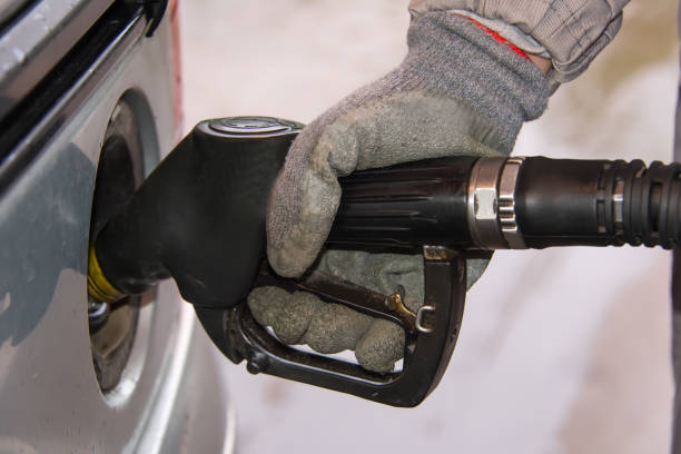 istock Fueling a car at a gas station. 854663800