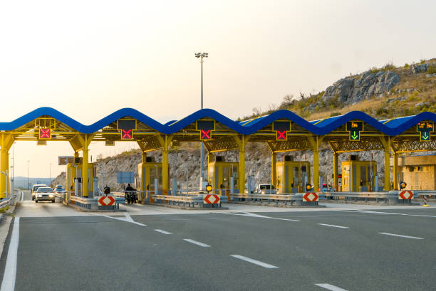 istock Cars passing through the toll gate on the motorway 854668552