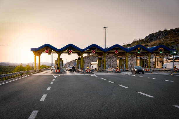 istock Cars passing through the toll gate on the motorway 854668656