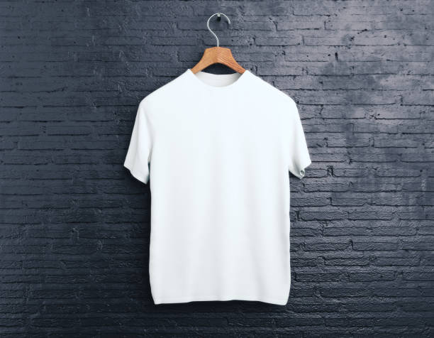 weißes t-shirt auf ziegel-hintergrund - white clothing stock-fotos und bilder