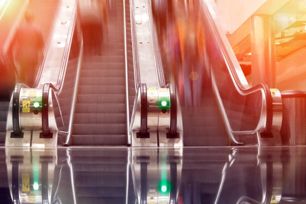 People rushing in escalators People rushing in escalators upward mobility stock pictures, royalty-free photos & images