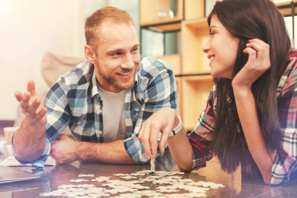istock Cheerful freelancers relaxing and playing puzzle game 854687514