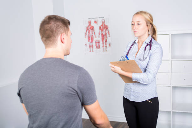 istock Doctor examining her patient in medical office 854687778