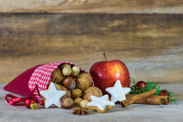 istock Christmas composition with nuts, star cookies and apple 854693372