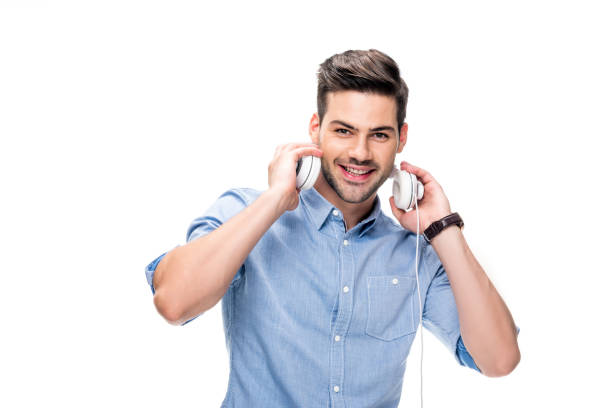 istock man taking off headphones 854713884