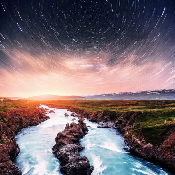 Photo of Hodafoss very beautiful Icelandic waterfall. It is located in the north near Lake Myvatn and the Ring Road. Fantastic starry sky and the milky way