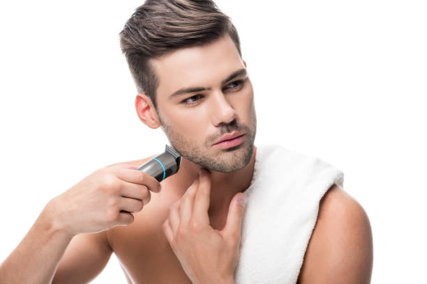 istock man shaving with electric trimmer 854717958