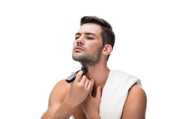 istock man shaving with electric trimmer 854718934