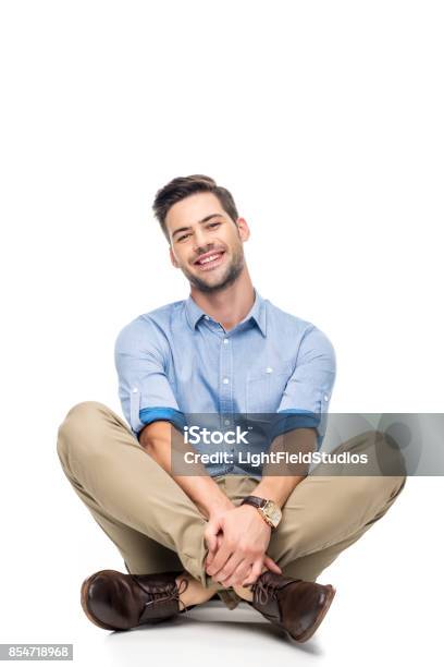Young Man Sitting On Floor Stock Photo - Download Image Now - Men, Sitting On Ground, White Background