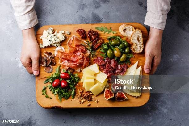 Italian Snacks Food With Ham Olive Cheese Sundried Tomatoes Sausage And Bread Stock Photo - Download Image Now