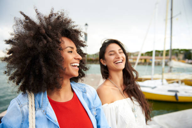 istock Two happy women friends laughing 854733760