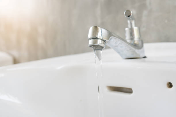 istock close up white sink with faucet 854748048