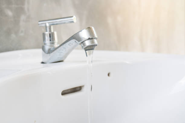 istock close up white sink with faucet 854753658