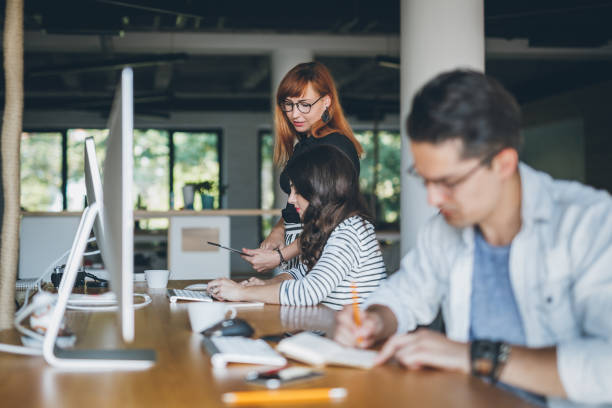 istock Coworkers working together in the office 854761508