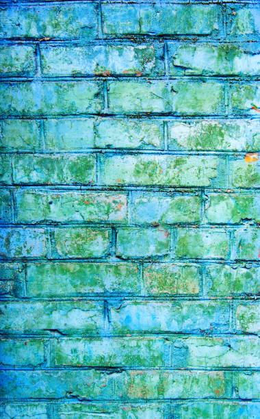 istock Texture of old blue and gray brick wall surface with cement and concrete seams 854780112