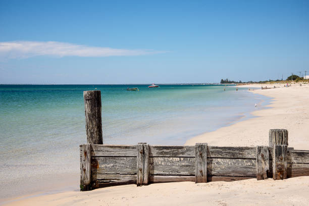 Scenic old jetty remains on Busselton Beach at Geographe Bay, Western Australia stock photo