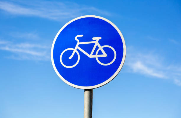 Bicycle sign for bikes lane against the blue sky