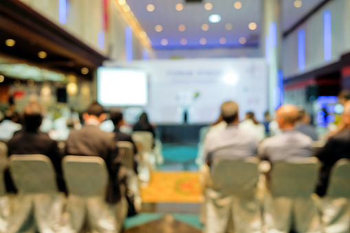 Empty conference hall with podium and presentation screens 3D rendering