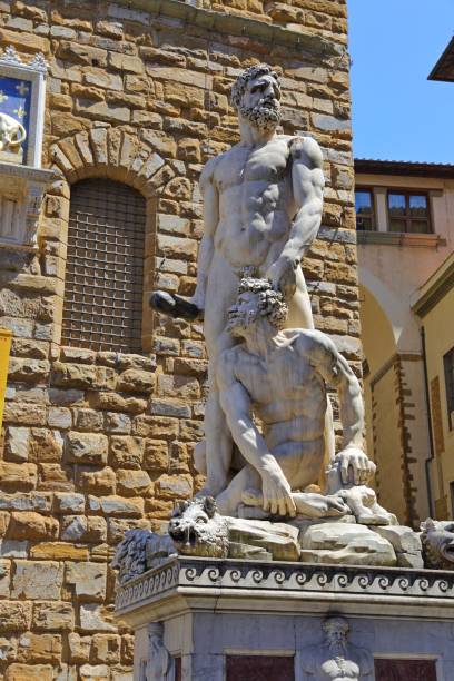 Hercules and Cacus Statue by Bandinelli Hercules and Cacus Statue by Bandinelli at Piazza della Signoria in Florence, Italy hercules florence italy muscular build statue stock pictures, royalty-free photos & images