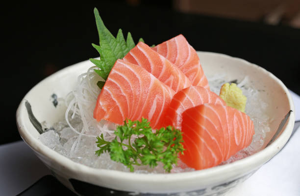 istock Close-up Sliced salmon raw sashimi on ice. 854860144