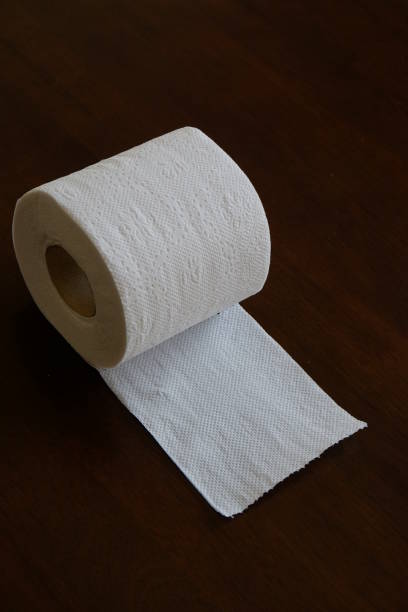istock toilet paper roll in black background 854862848