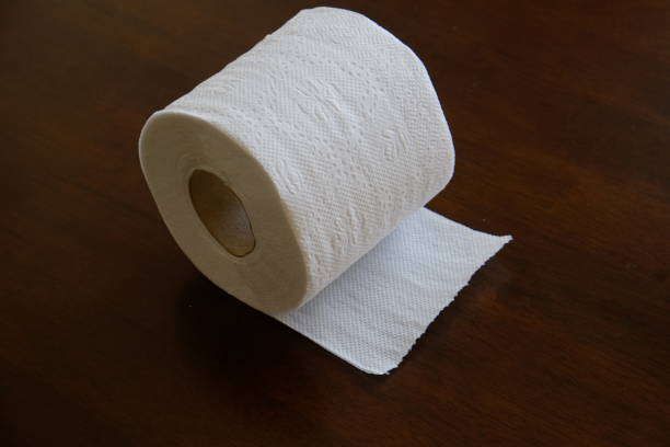 istock toilet paper roll in black background 854863594