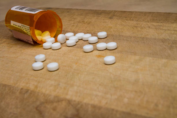 istock bottle of spilled pills 854880270