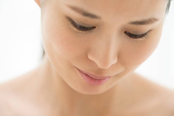 istock The face of a woman facing down. 854885646