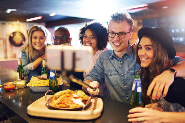 istock Friends doing selfie with beer at bar 854892924