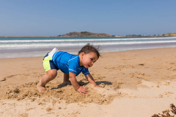 istock Happy Aboriginal Australian Boy Playing at the Beach 854893704